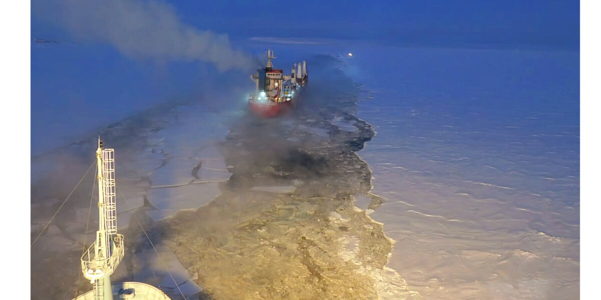 Arktika nuclear icebreaker assisted ship in mooring at the ice platform